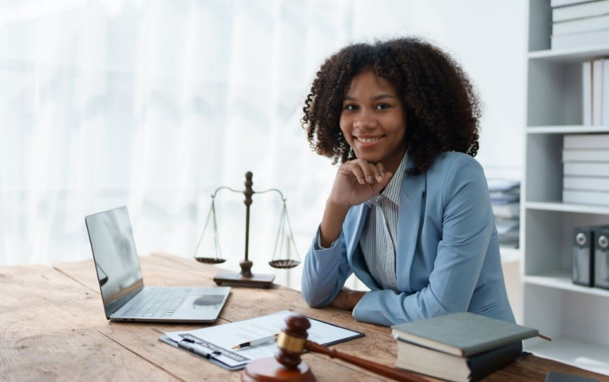 smiling attorney in her desk