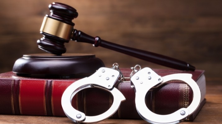 gavel bible and handcuffs