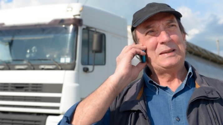 a truck driver calling his insurance company