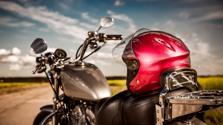 motorcycle with helmeent at the top of the back seat