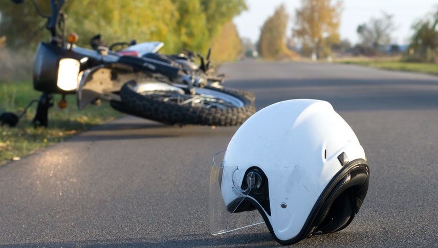 motorcycle accident with the helmet on the road