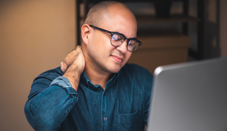 man having back pain after car accident