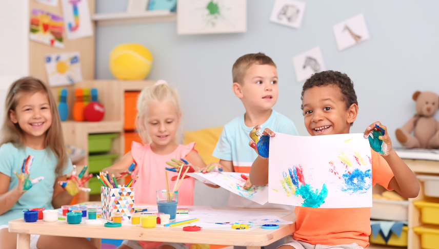 children painting on a table