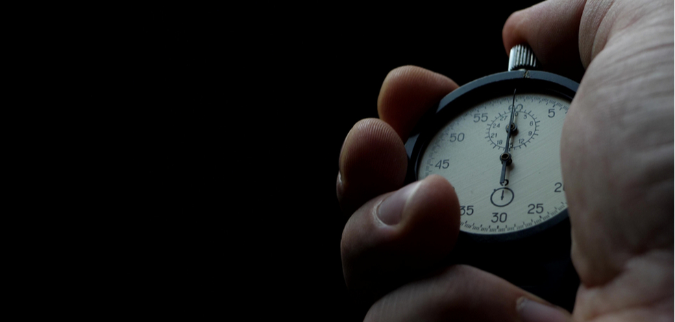 a stop watch in a hand