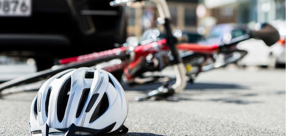a white helmet with red bike at the back