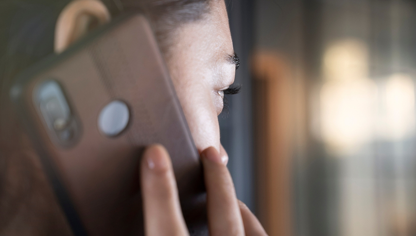 woman calling her attorney in her phone