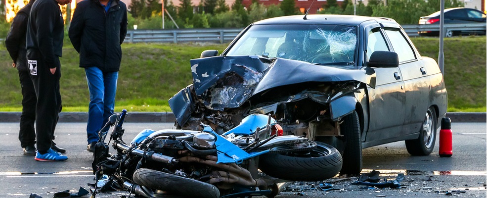 a car and motorcycle involved in an accident
