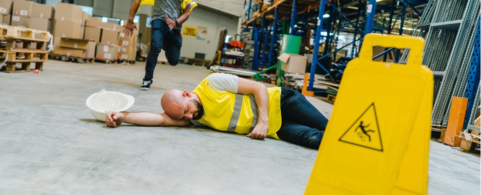 a man unconcious after falling on a warehouse