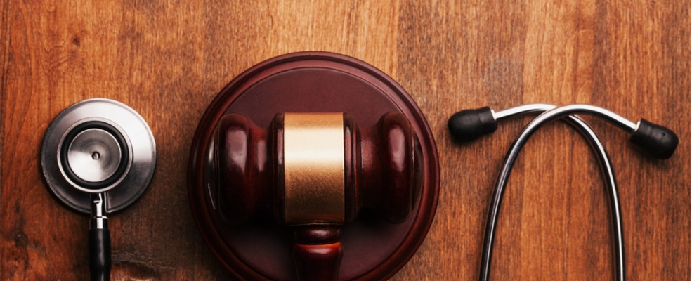 a stethoscope and a gavel in the center
