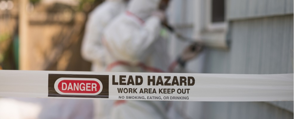 a warning sign of an area surrounded by toxic lead