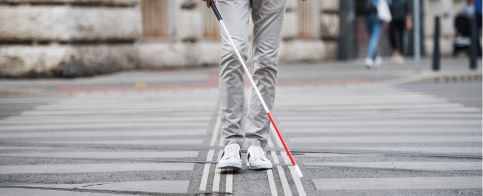 blind man walking in a pedestrian lane