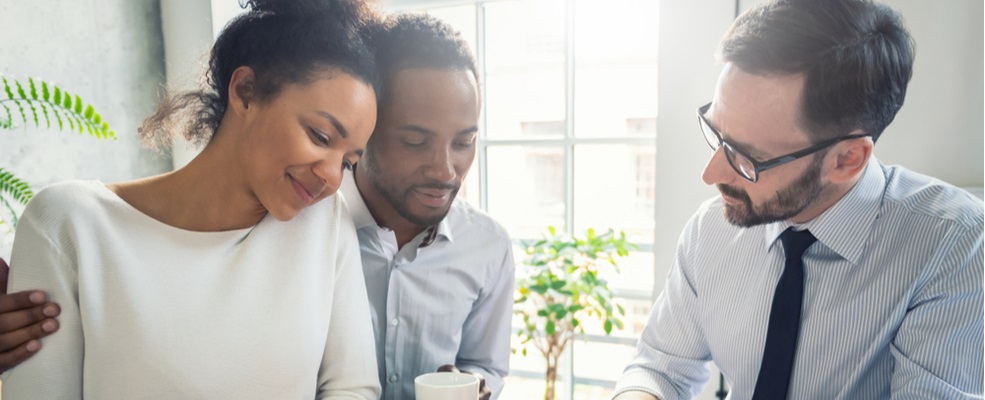 couple discussing insurance with an agent