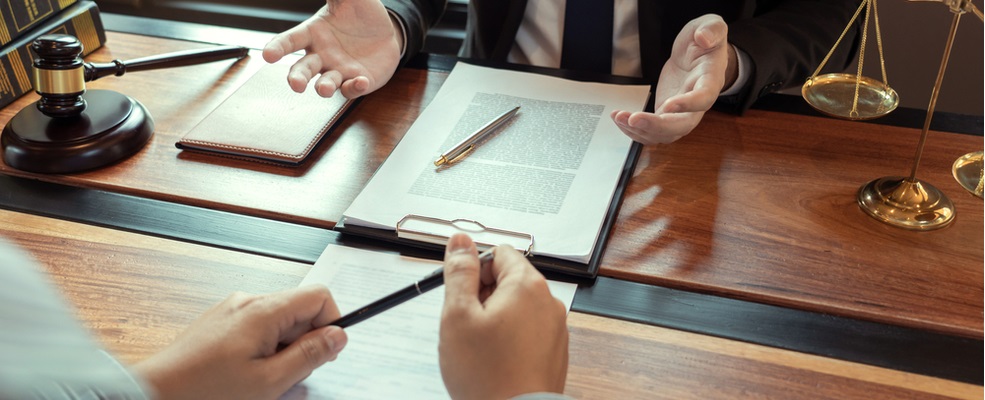lawyer explaining a paraquat case to a client