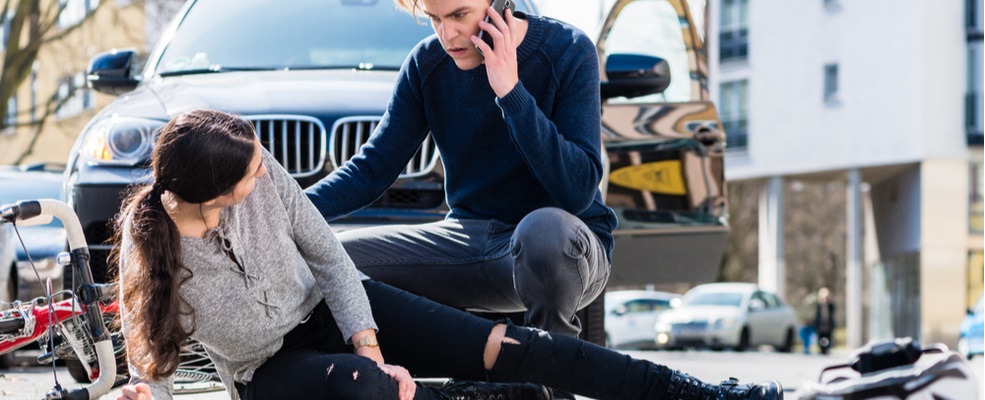 man calling his attorney because of bicycle accident