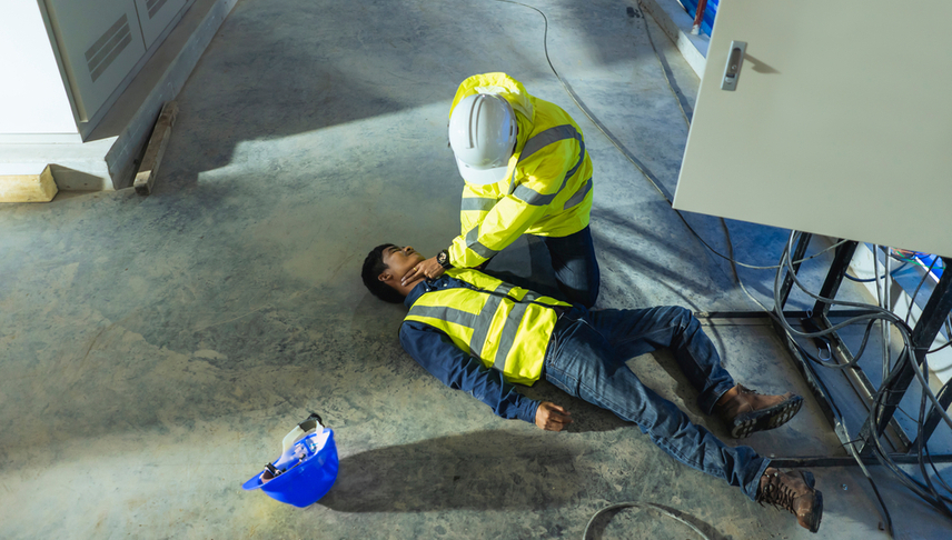 man checking his partner who is electrocuted for vital signs