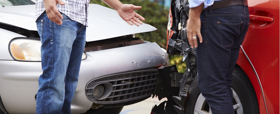 two guys discussing the car accident that happen