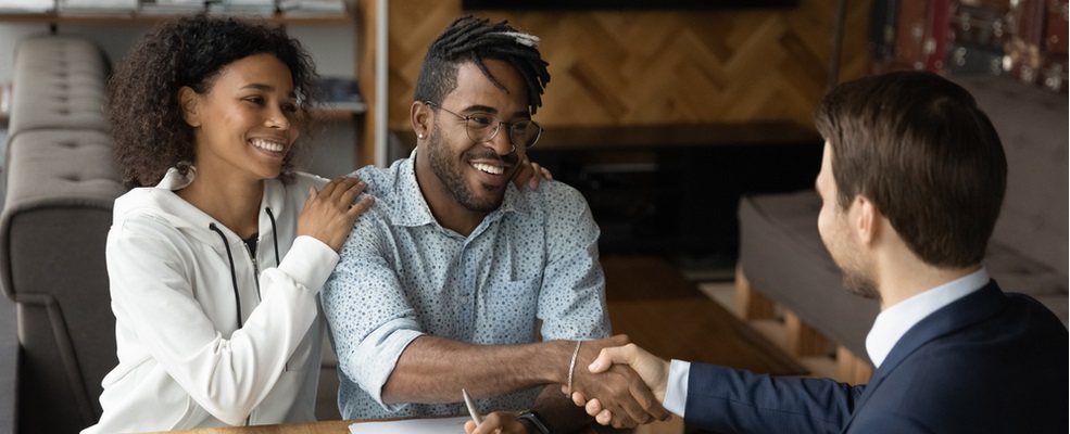 couple shaking hands with a personal injury attorney in new jersey