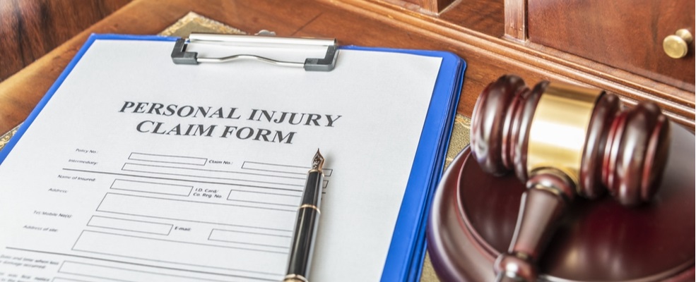 personal injury claim form with a gavel beside it
