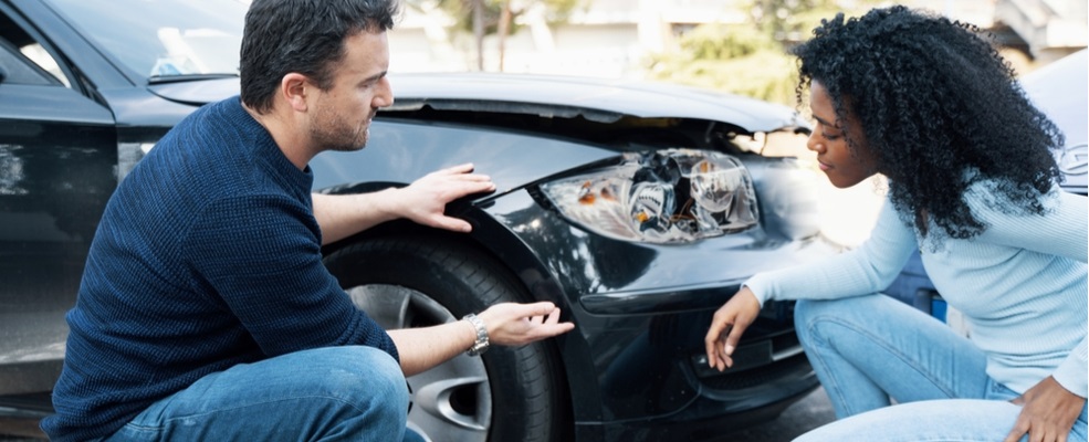 two people in hackensack discussing about a car accident