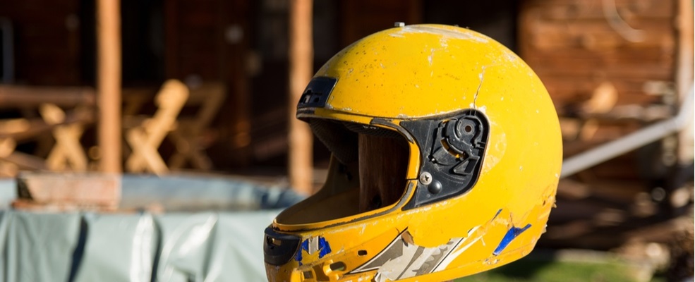 a worn out motorcycle helmet after a motorcycle accident