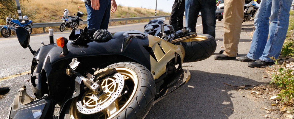 police officers discussing who is at fault in a motorcycle accident