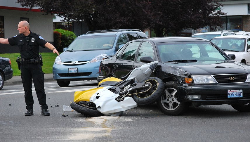 a motorcycle and a car in a collision
