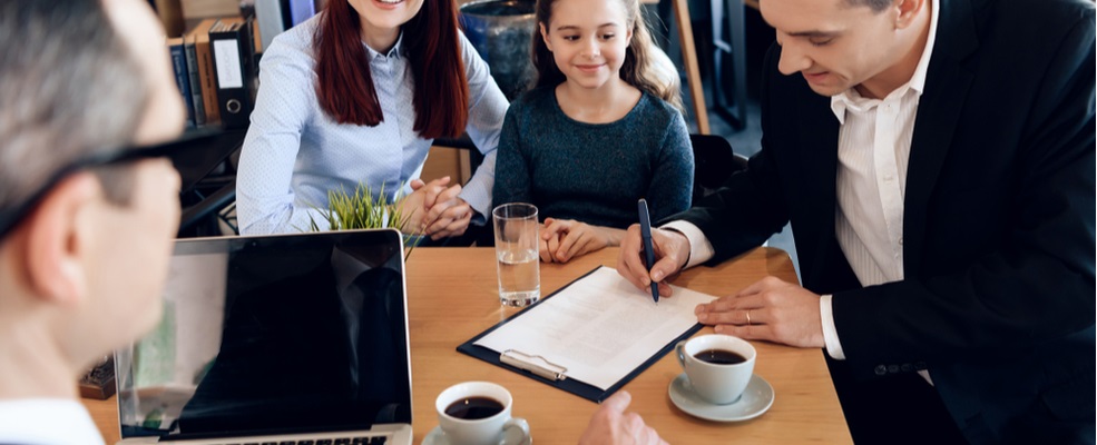 family signing attorney agreement representation for a child injury case