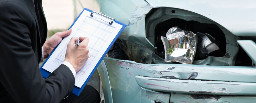 after an accident an insurance agent inspects the vehicle to ensure proper compensation