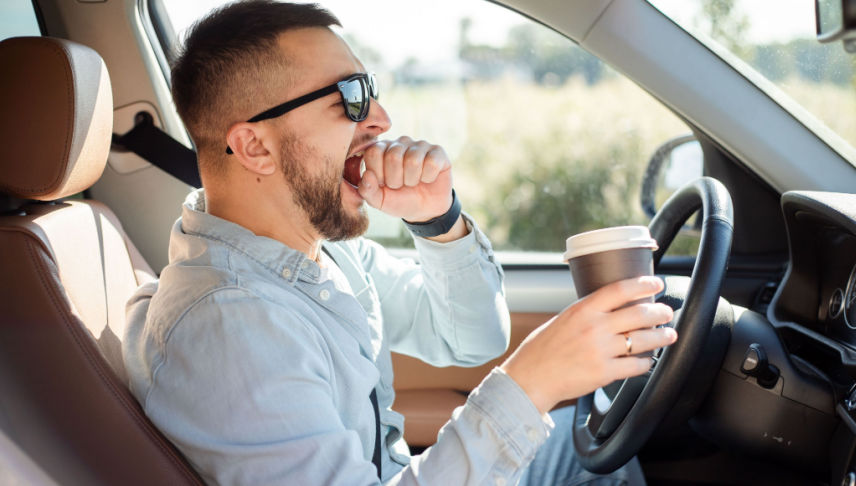 driving man feeling tired and drowsy