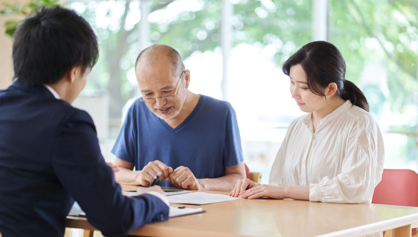 old man with daughter consulting attorney about nursing home negligence