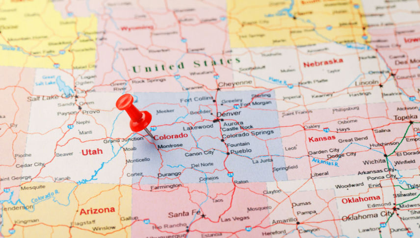 red clerical needle on map of usa pointing at colorado