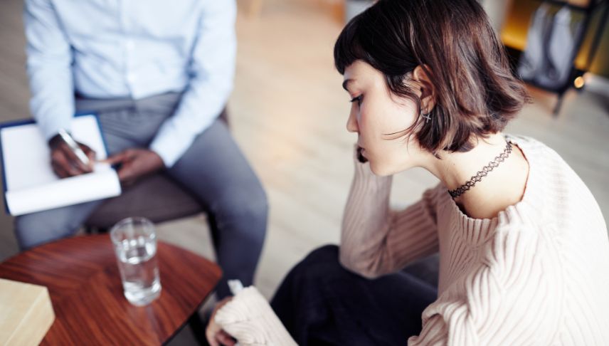 emotional distress woman talking to lawyer office