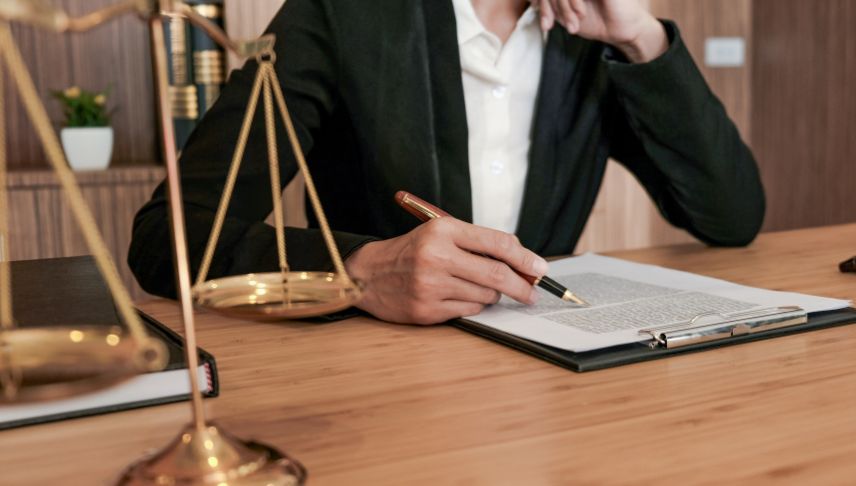 personal injury attorney checking documents of his client