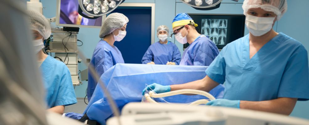 anesthesiologist at work in operating room