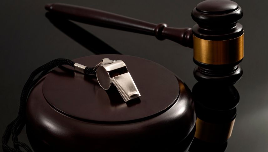 gavel and whistle on black table