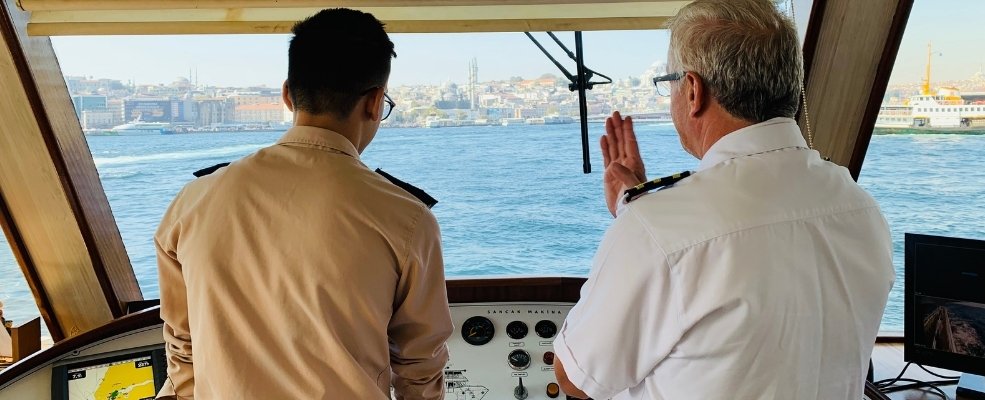 captain and officer talking in a ship