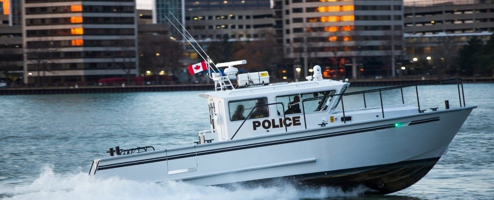 police boat cruising in a river