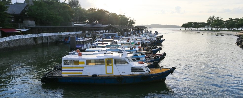 several boats anchored in a river