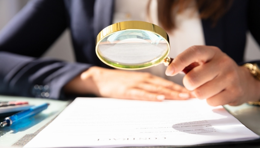lawyer holding a magnifying glass