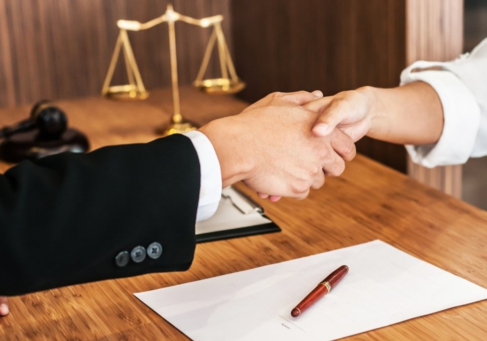 lawyer shaking hands with a client