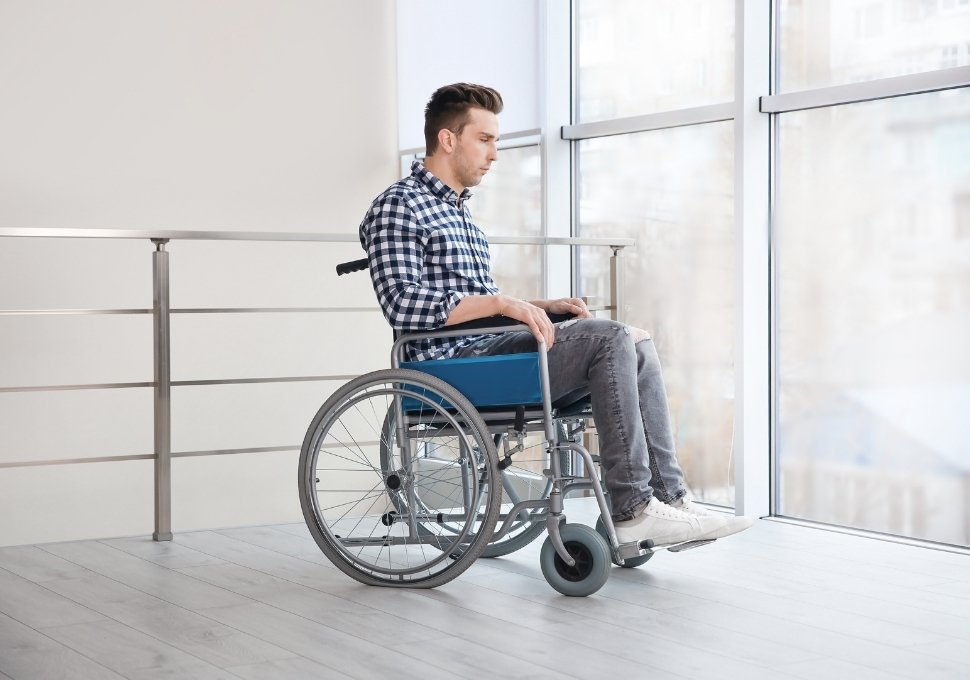 man in a wheel chair after a car accident