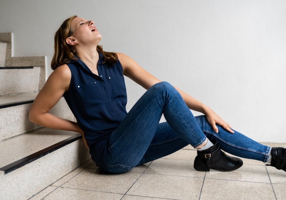 woman slipping and falling from stairs